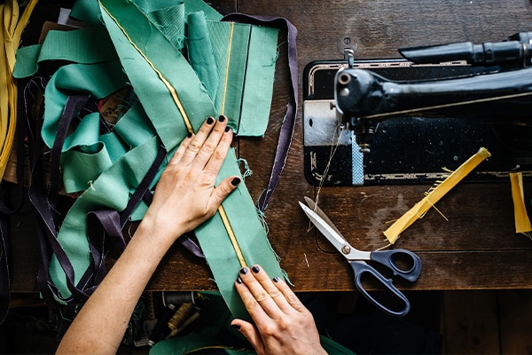A crafter tailors fabrics.