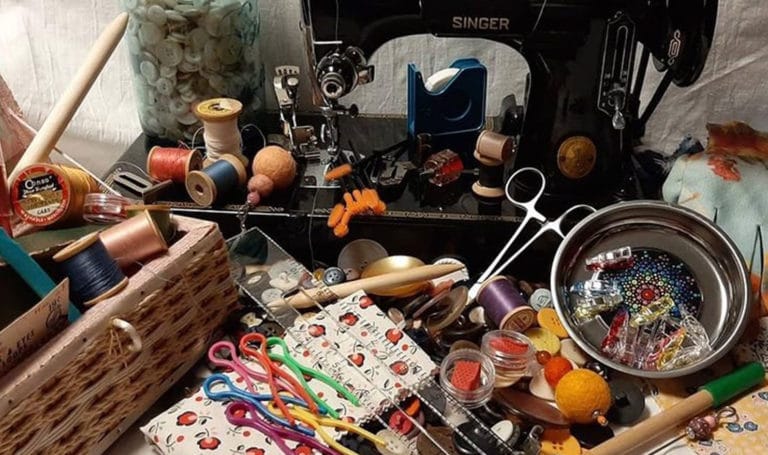 ACT Spotlight artist, Joan Radell, shows off her showing machine with all of her sewing tools she has invented and sells at craft shows.