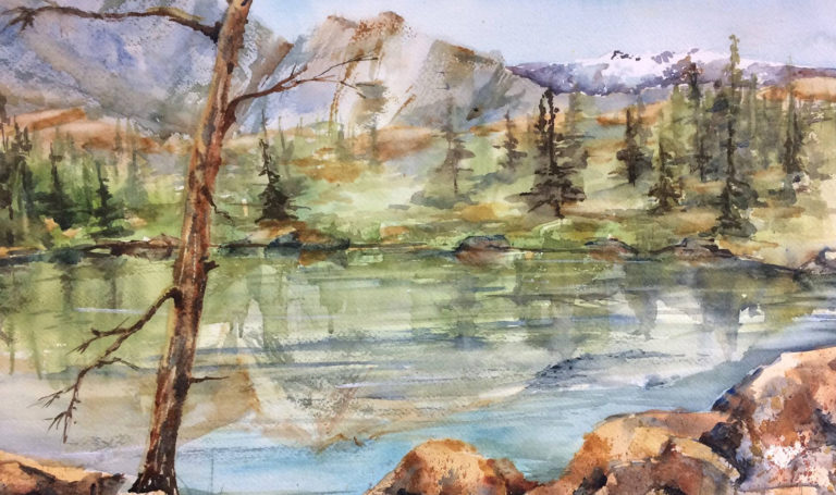 Karen Martin's watercolor painting of a lake nestled between green pine trees and mountains.