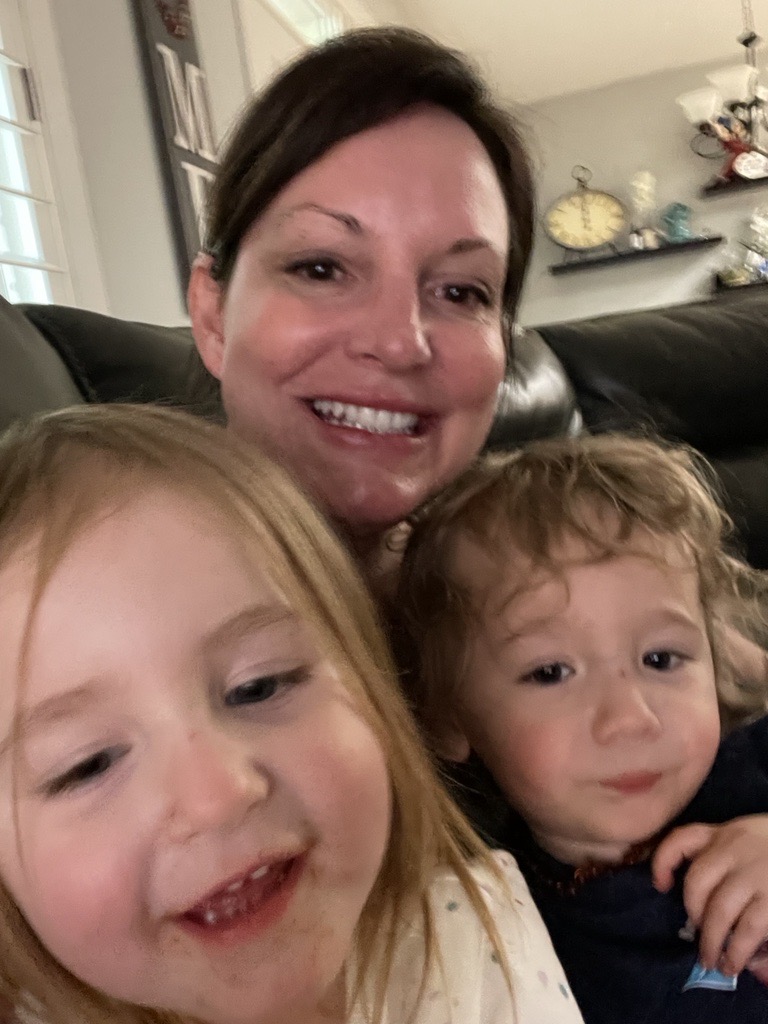 JoAnne takes a selfie with two of her grandkids.