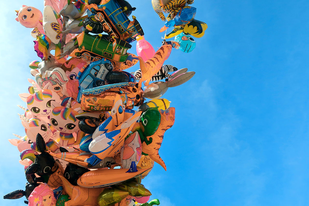 childrens' balloons in the sky.