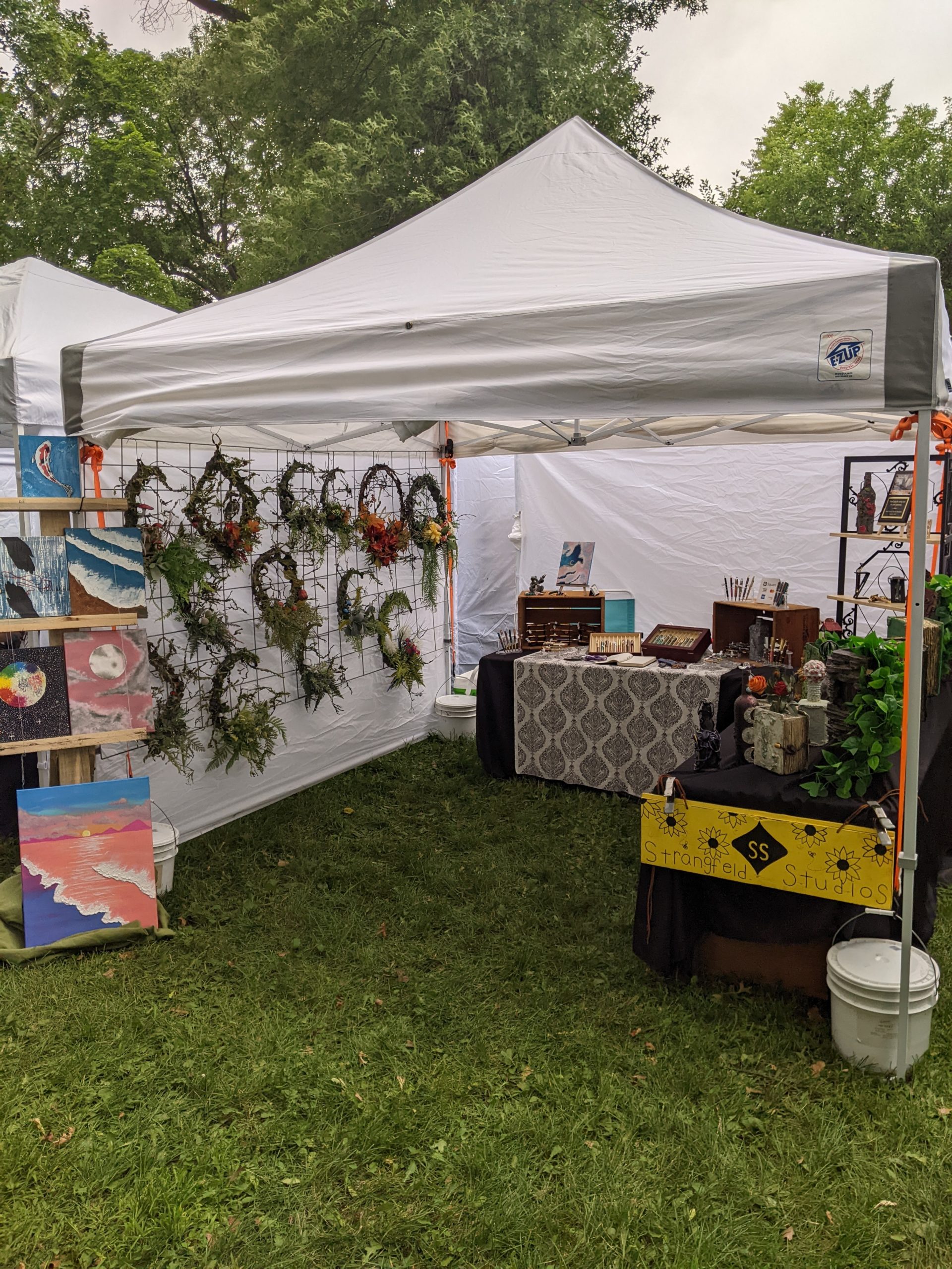 A photo of Scott and Corinne's booth at a craft fair.