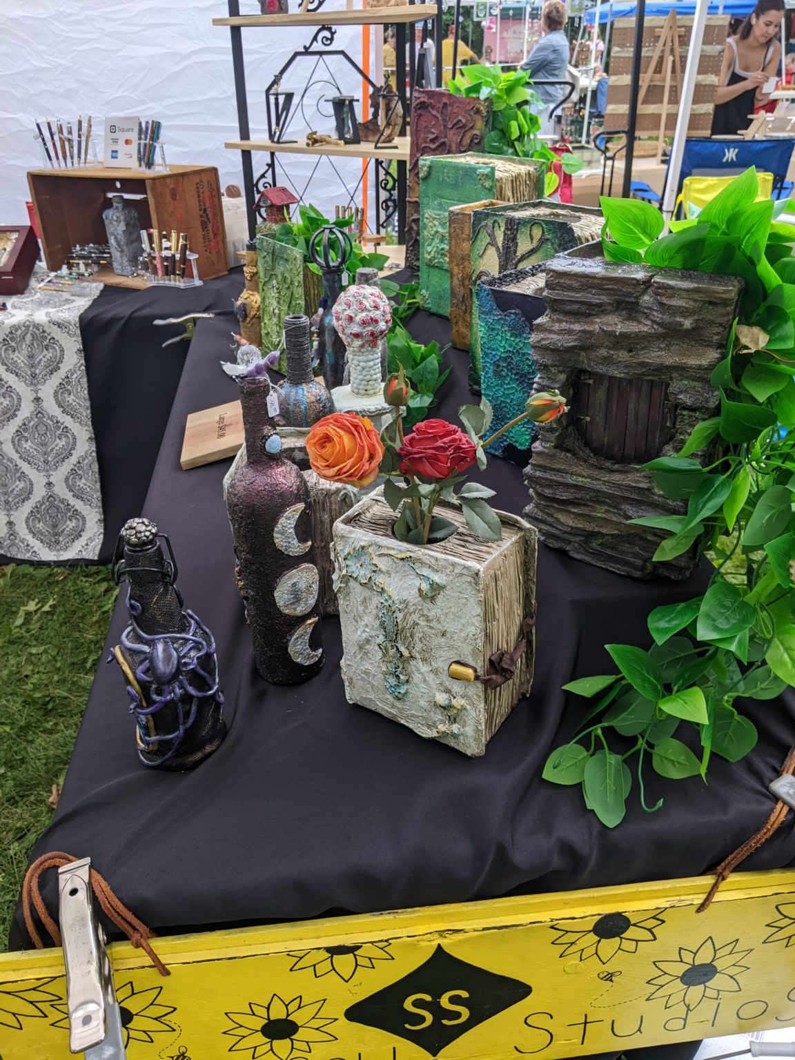 A close up look at some of the products Scott and Corinne sell at their vendor booth, such as handcrafted pens and vases.